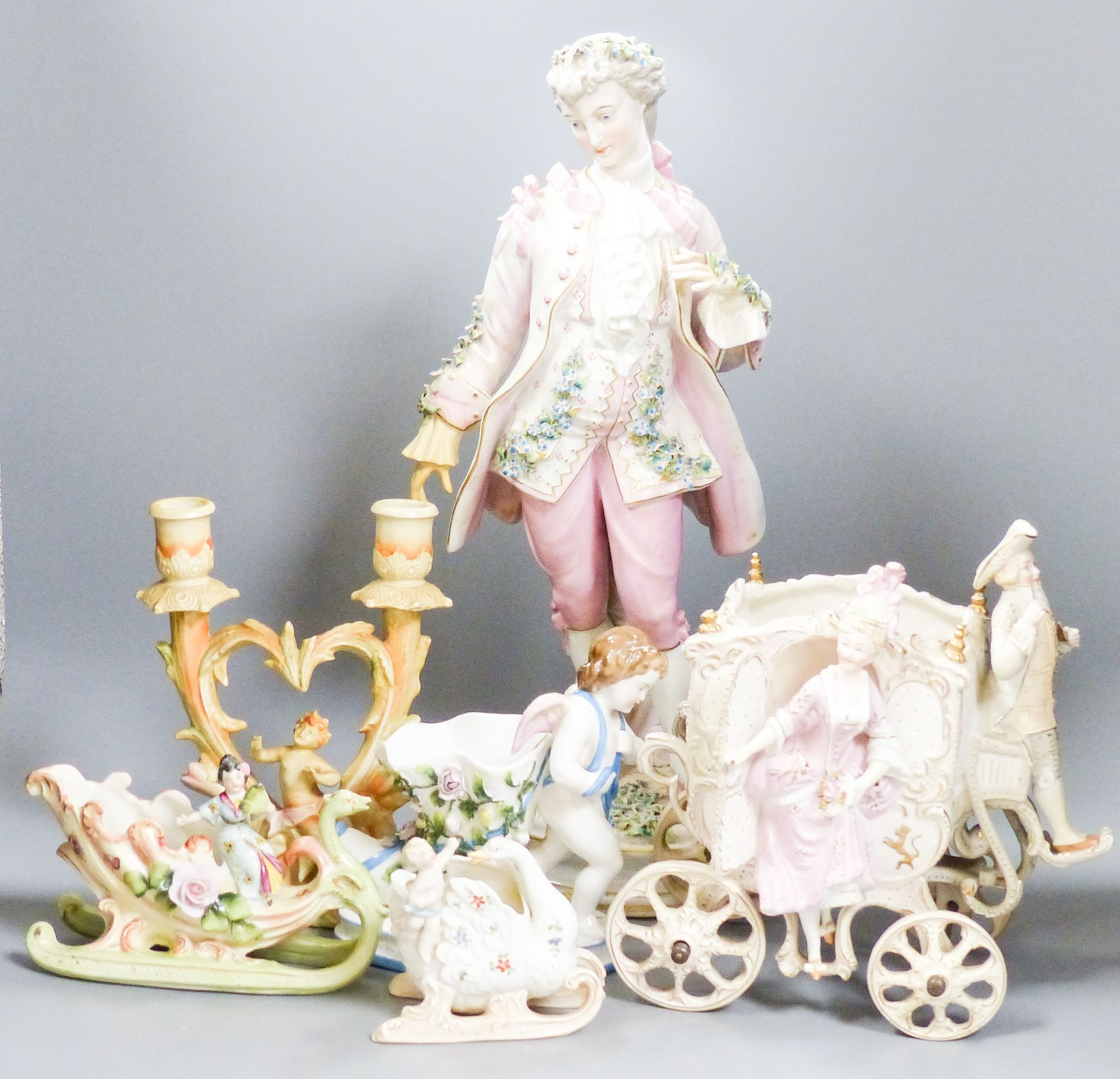 A bisque carriage centrepiece, a Continental figure and decorative items